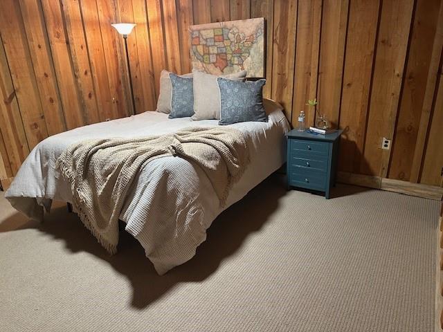 31 Pine Road Dahlonega, GA 30533 - Photo 21 of 32 a bed sitting in a bedroom next to a wooden shower