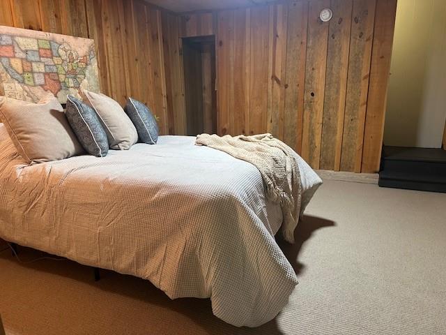 31 Pine Road Dahlonega, GA 30533 - Photo 22 of 32 a bed sitting in a bedroom next to a wooden door