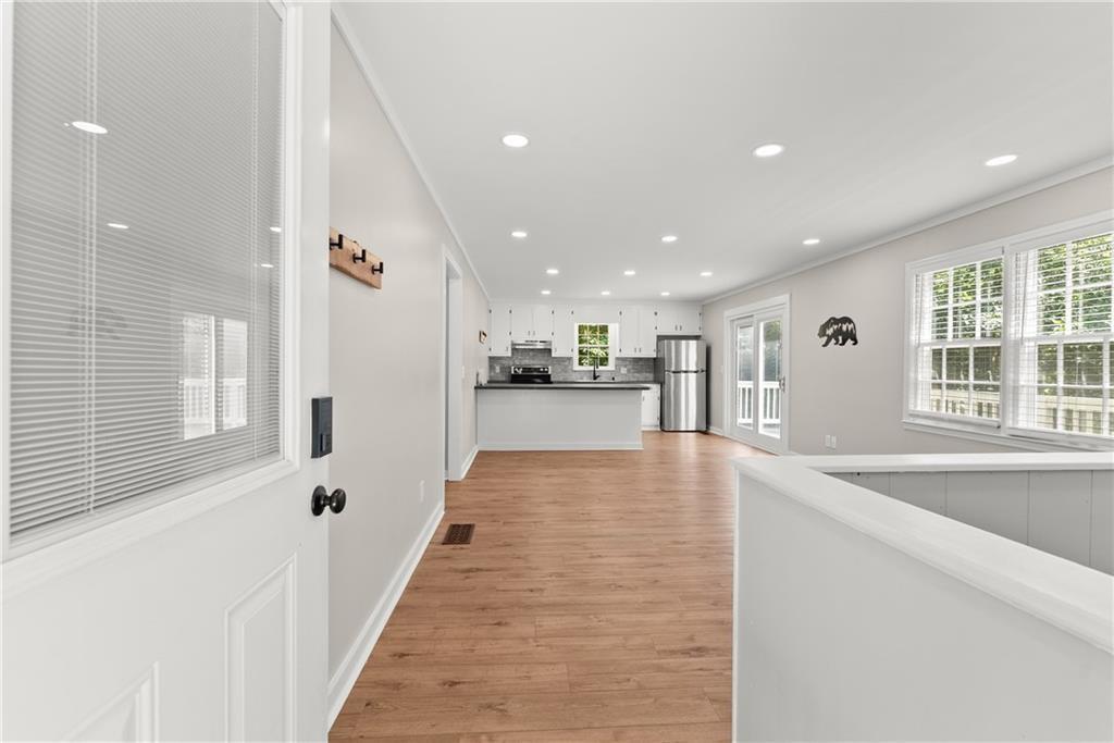 31 Pine Road Dahlonega, GA 30533 - Photo 8 of 32 a view of a kitchen with kitchen island a stove a refrigerator a sink dishwasher with a dining table and chairs