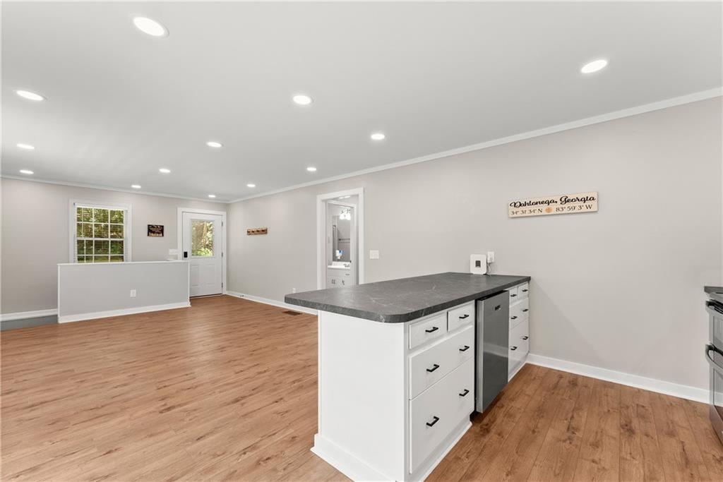 31 Pine Road Dahlonega, GA 30533 - Photo 10 of 32 a kitchen with a sink and wooden floor