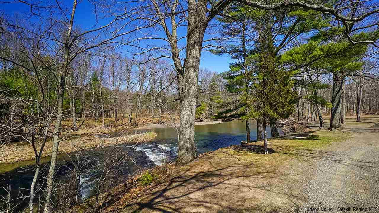 124 Wilhelm Road Saugerties, NY 12477 - Photo 3 of 33 a view of a yard with wooden fence