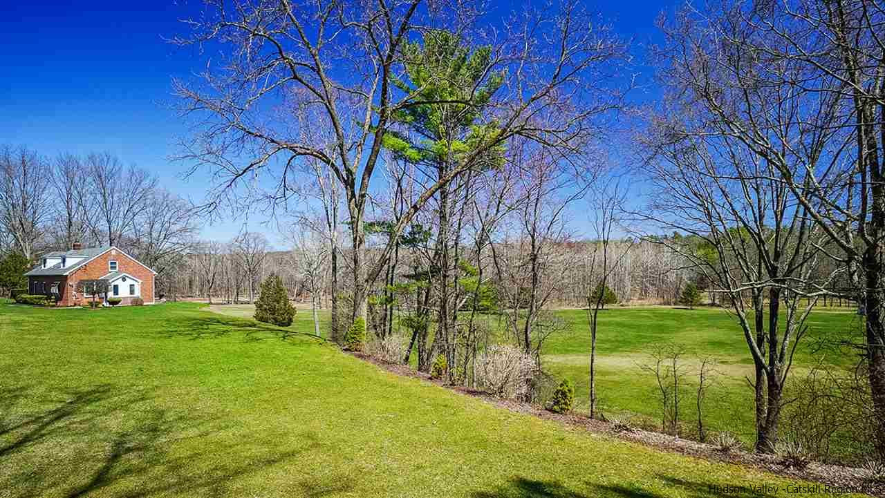 124 Wilhelm Road Saugerties, NY 12477 - Photo 8 of 33 a backyard of a house with lots of green space