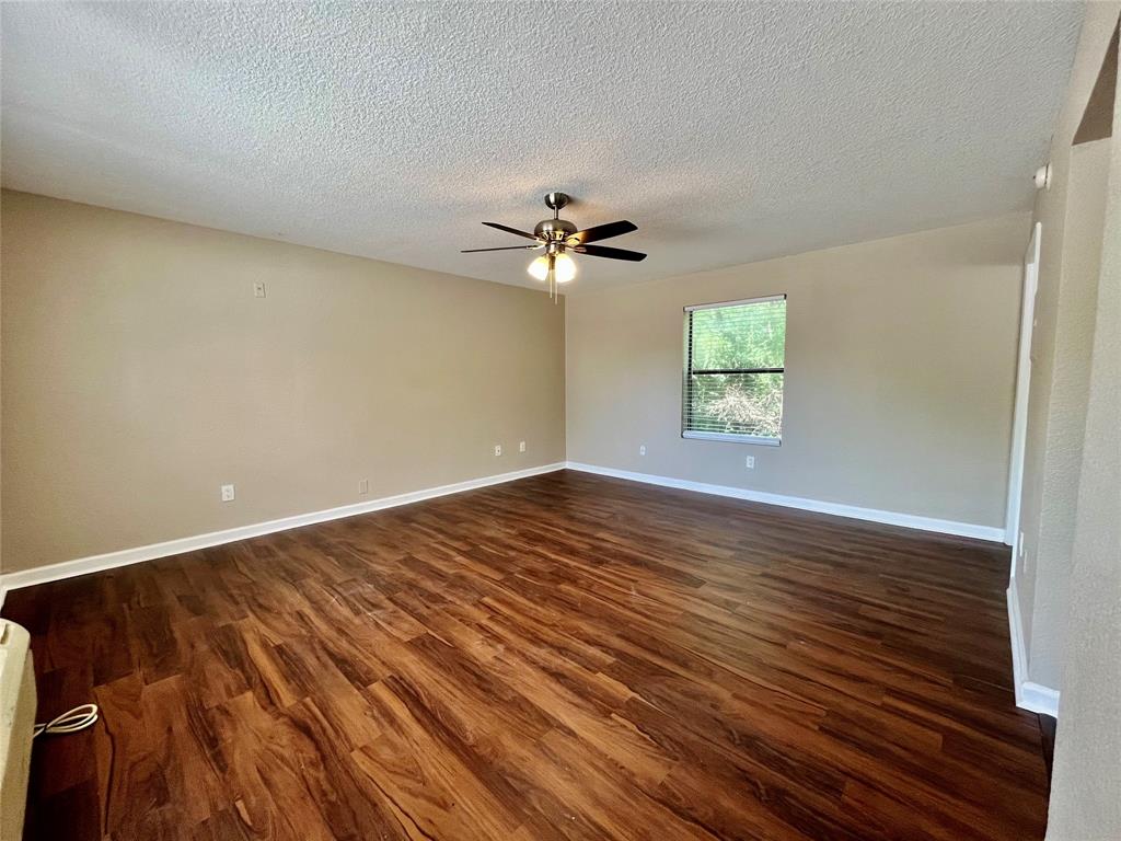 701 West Sycamore Street, Unit 104 Denton, TX 76201 - Photo 4 of 10 Spacious secondary view of the main living area, perfect for versatile furniture arrangements.