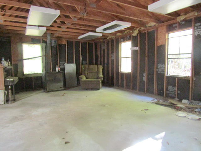 1290 Brake Road Elliston, VA 24087 - Photo 8 of 12 a living room with furniture and a chandelier