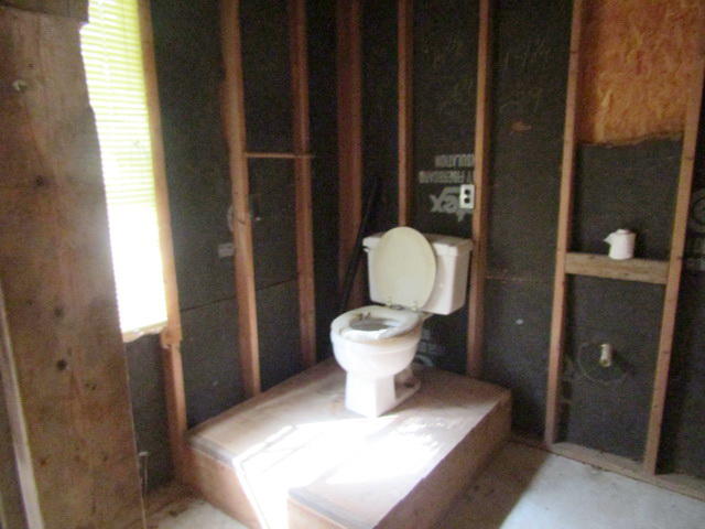 1290 Brake Road Elliston, VA 24087 - Photo 10 of 12 a white toilet sitting next to a bathroom sink