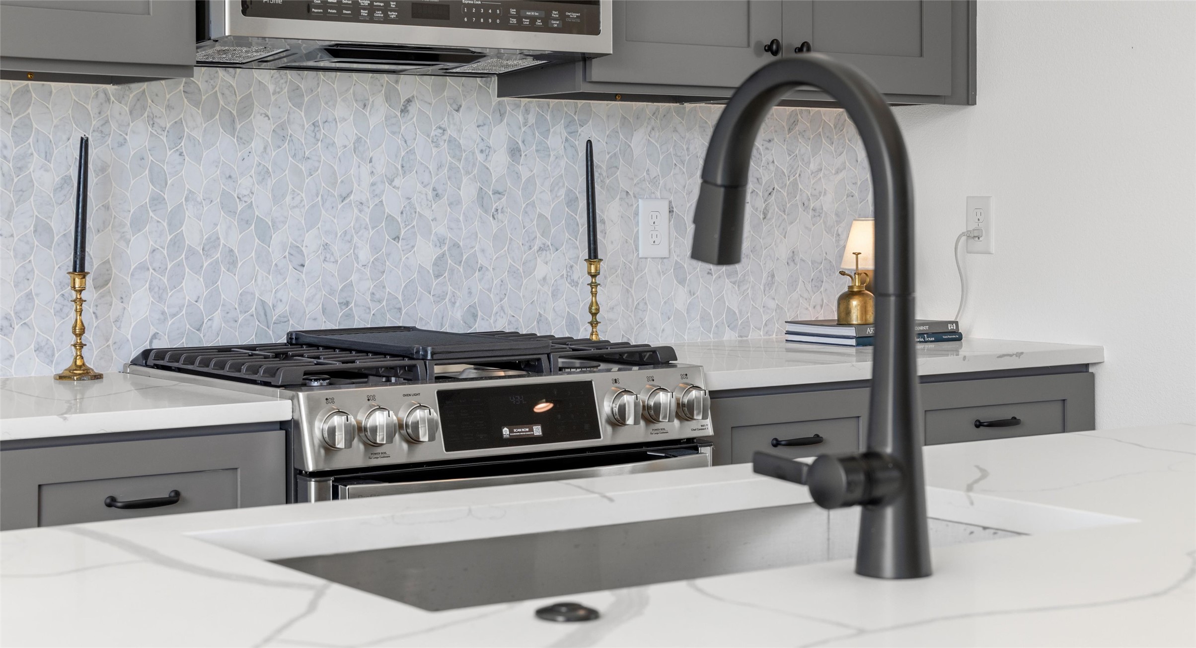 5912 Harold Court, Unit 107 Austin, TX 78721 - Photo 31 of 35 A chef-ready kitchen with a gas range and tile backsplash — the kind of space that makes cooking at home a joy. Model No. 105 Shown.