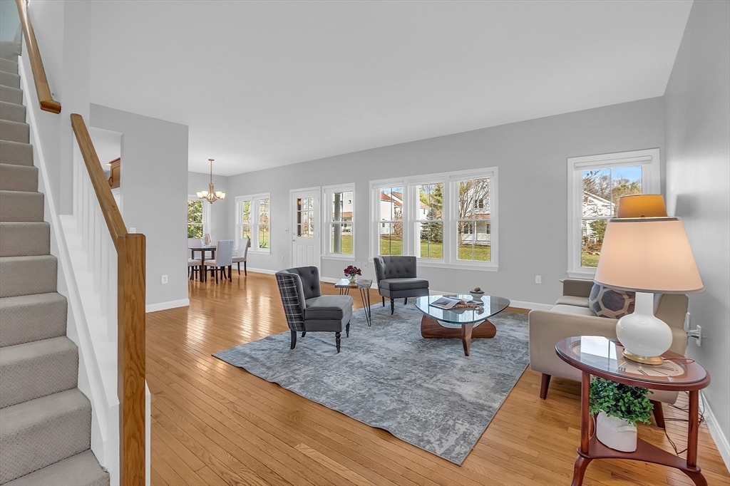 19 S Commons, Unit D Lincoln, MA 01773 - Photo 3 of 41 a living room with furniture and a table