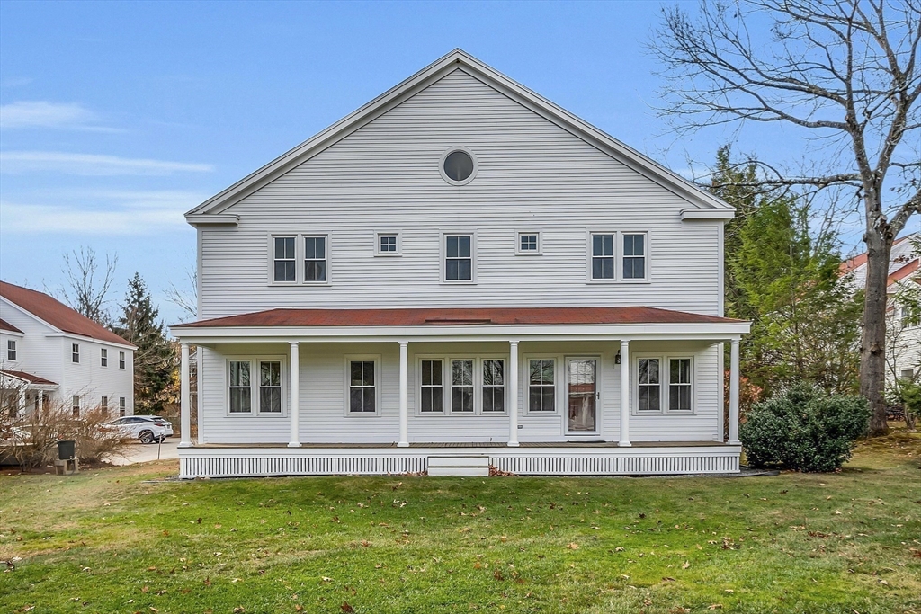 19 S Commons, Unit D Lincoln, MA 01773 - Photo 38 of 41 a front view of a house with a yard