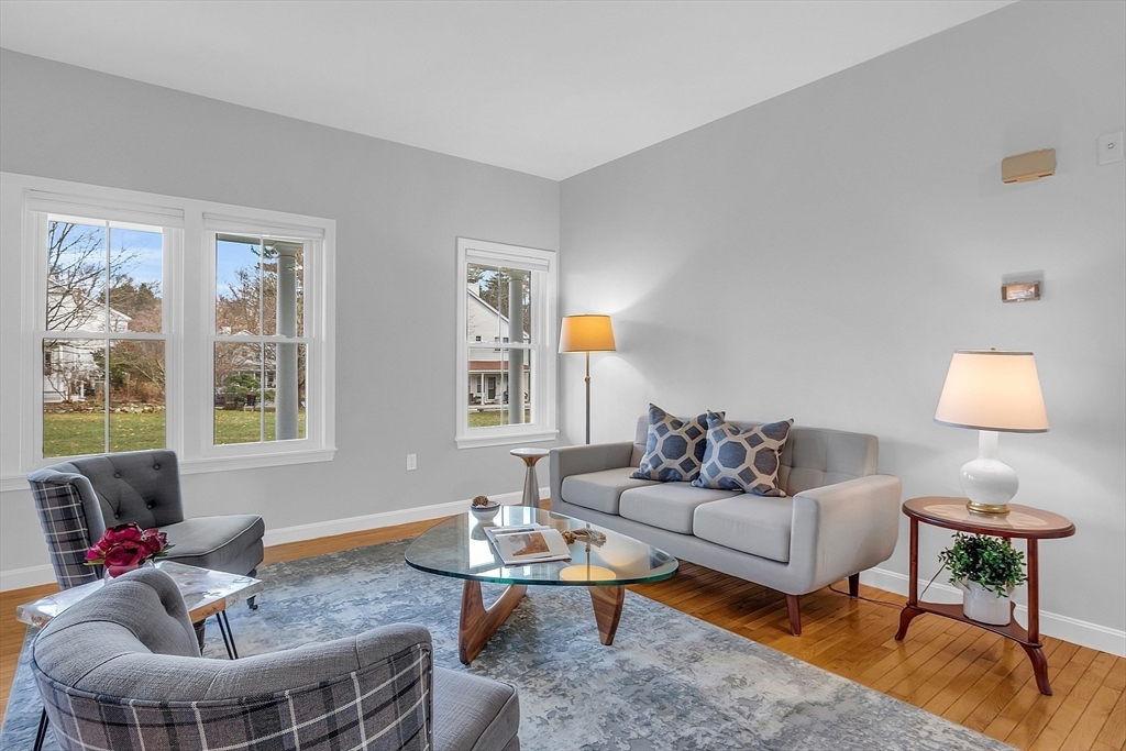 19 S Commons, Unit D Lincoln, MA 01773 - Photo 5 of 41 a living room with furniture and a window