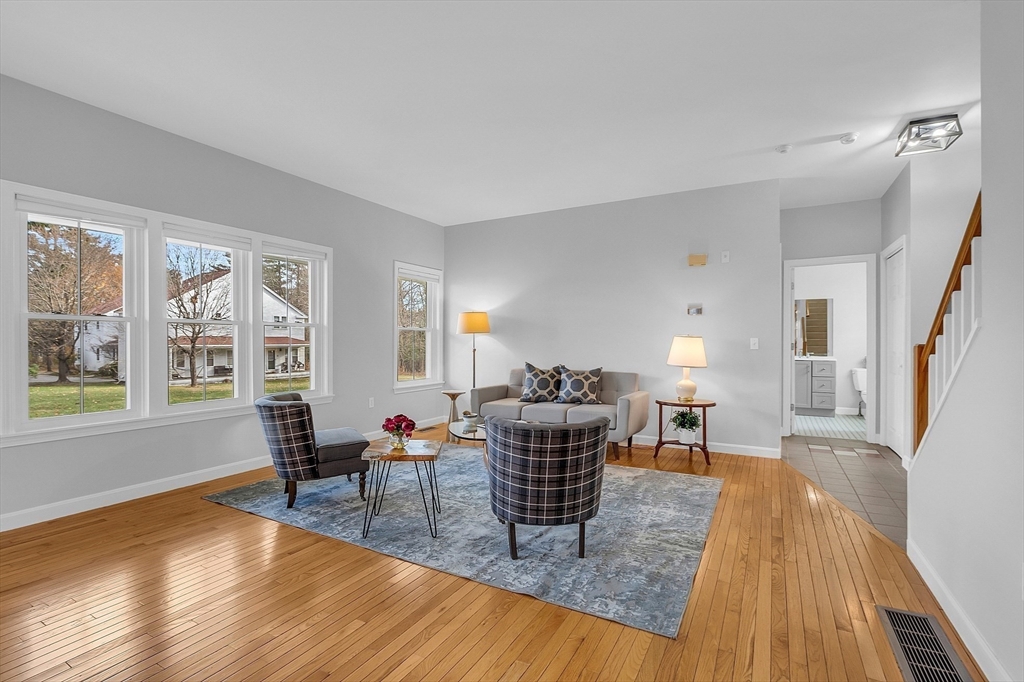 19 S Commons, Unit D Lincoln, MA 01773 - Photo 7 of 41 a living room with furniture and a wooden floor