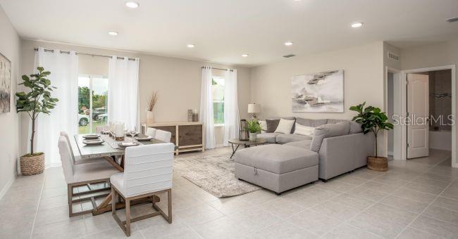 3 Porter Lane Palm Coast, FL 32164 - Photo 5 of 15 a living room with furniture and a potted plant