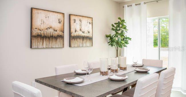 3 Porter Lane Palm Coast, FL 32164 - Photo 6 of 15 a view of a dining room with furniture window and outside view