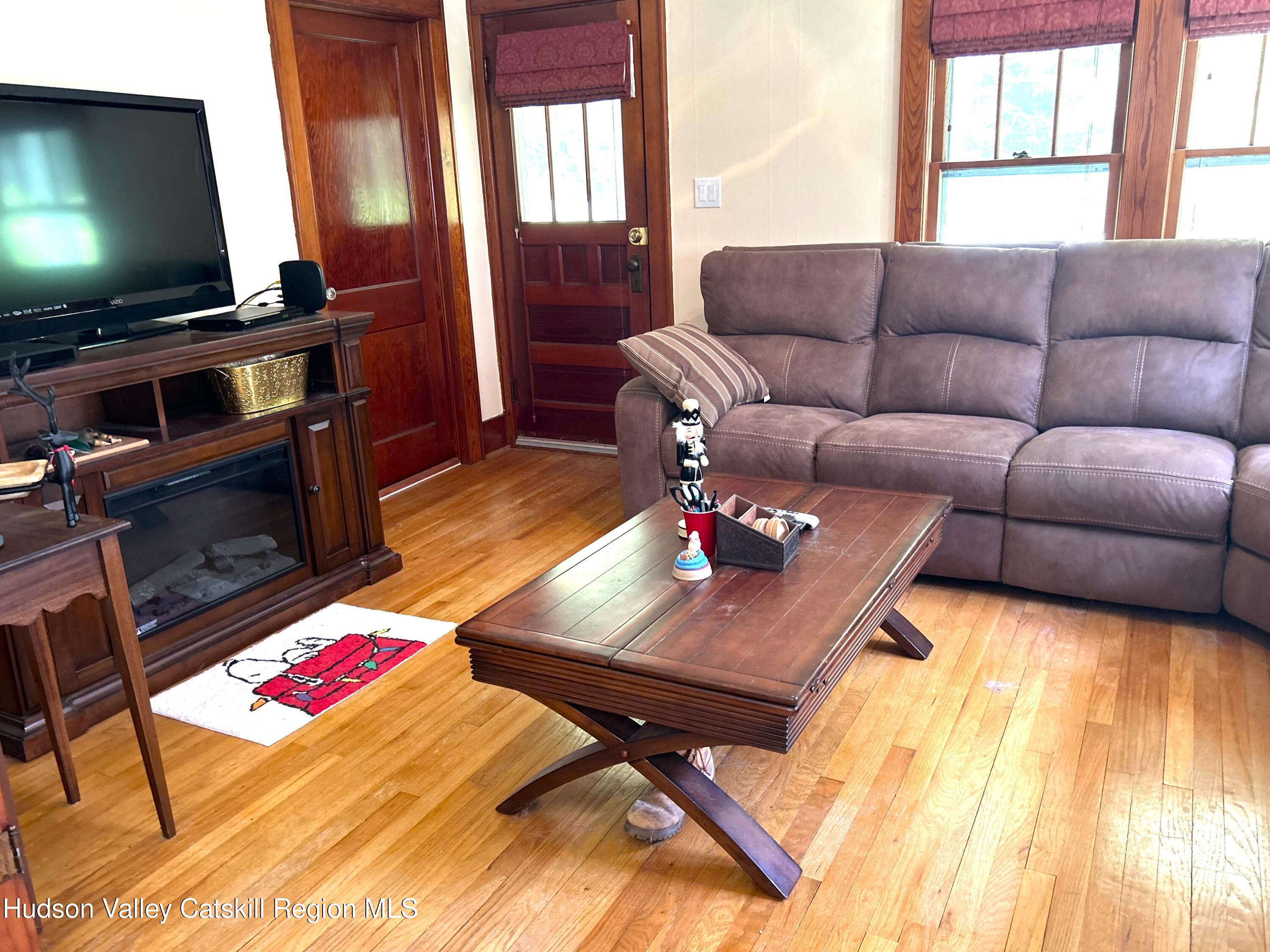 169 Rt 4 Prattsville, NY 12468 - Photo 13 of 43 a living room with furniture and a flat screen tv