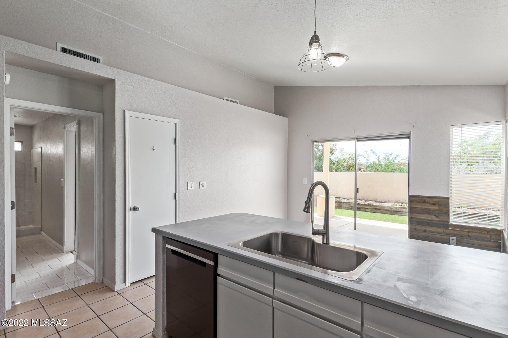 4697 West Weathervane Street Tucson, AZ 85741 - Photo 12 of 25 a kitchen with a sink and a window
