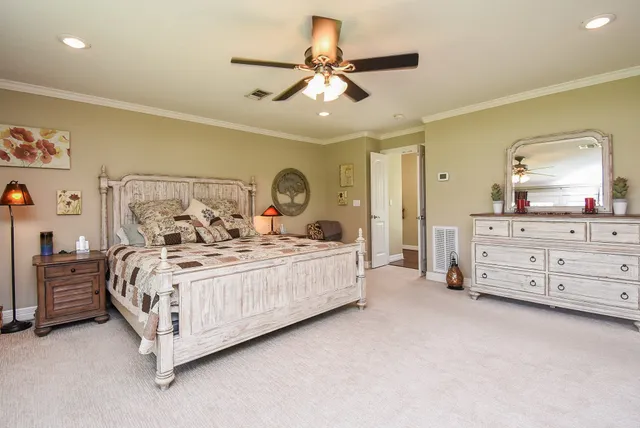 a bed room with a bed and a dresser