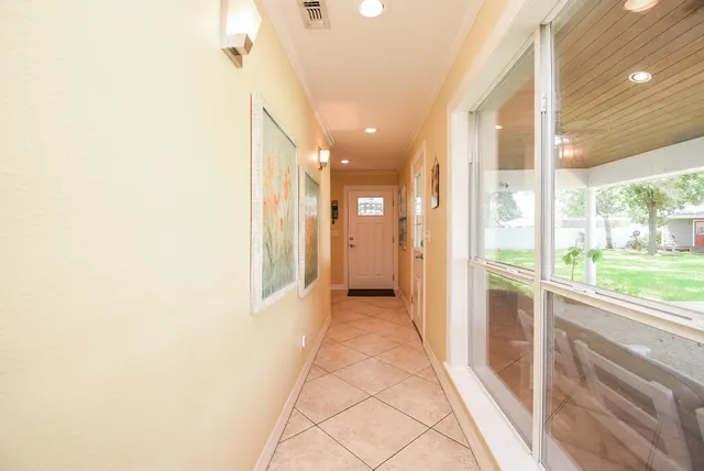 a view of a hallway with windows