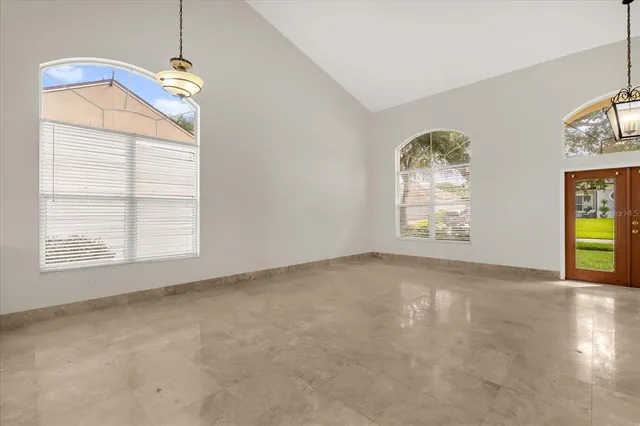 a view of an empty room with a window