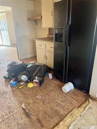 a view of storage and utility room with two washing machine