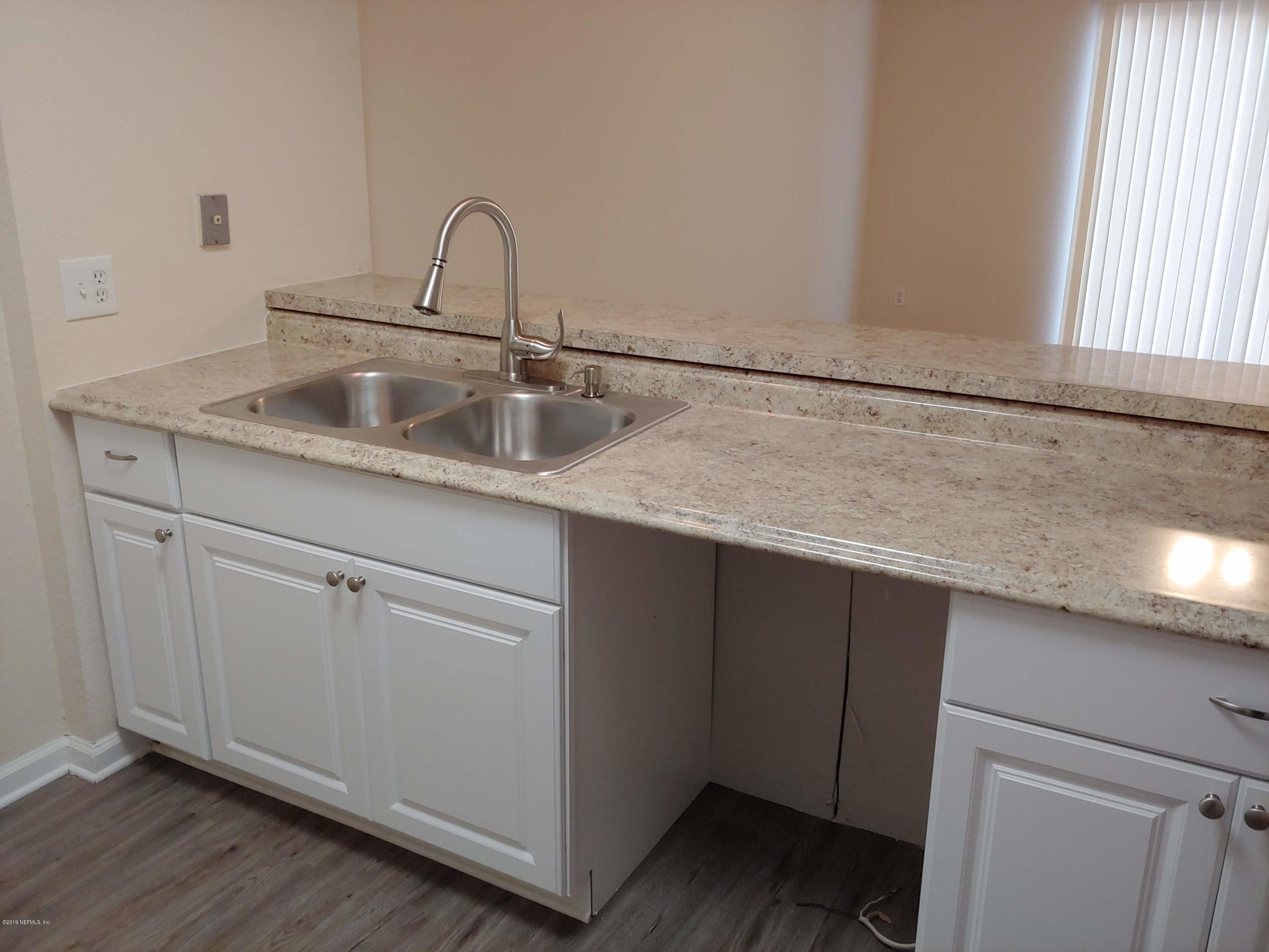 791 Assisi Lane, Unit 303 Jacksonville, FL 32233 - Photo 14 of 35 a close view of sink and tap