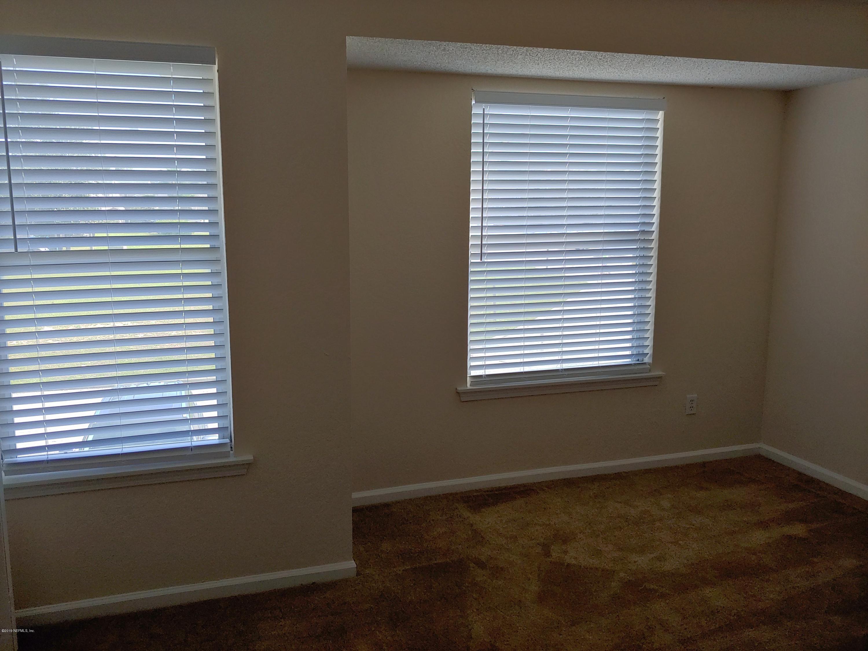 791 Assisi Lane, Unit 303 Jacksonville, FL 32233 - Photo 25 of 35 a view of a room that has a window in it