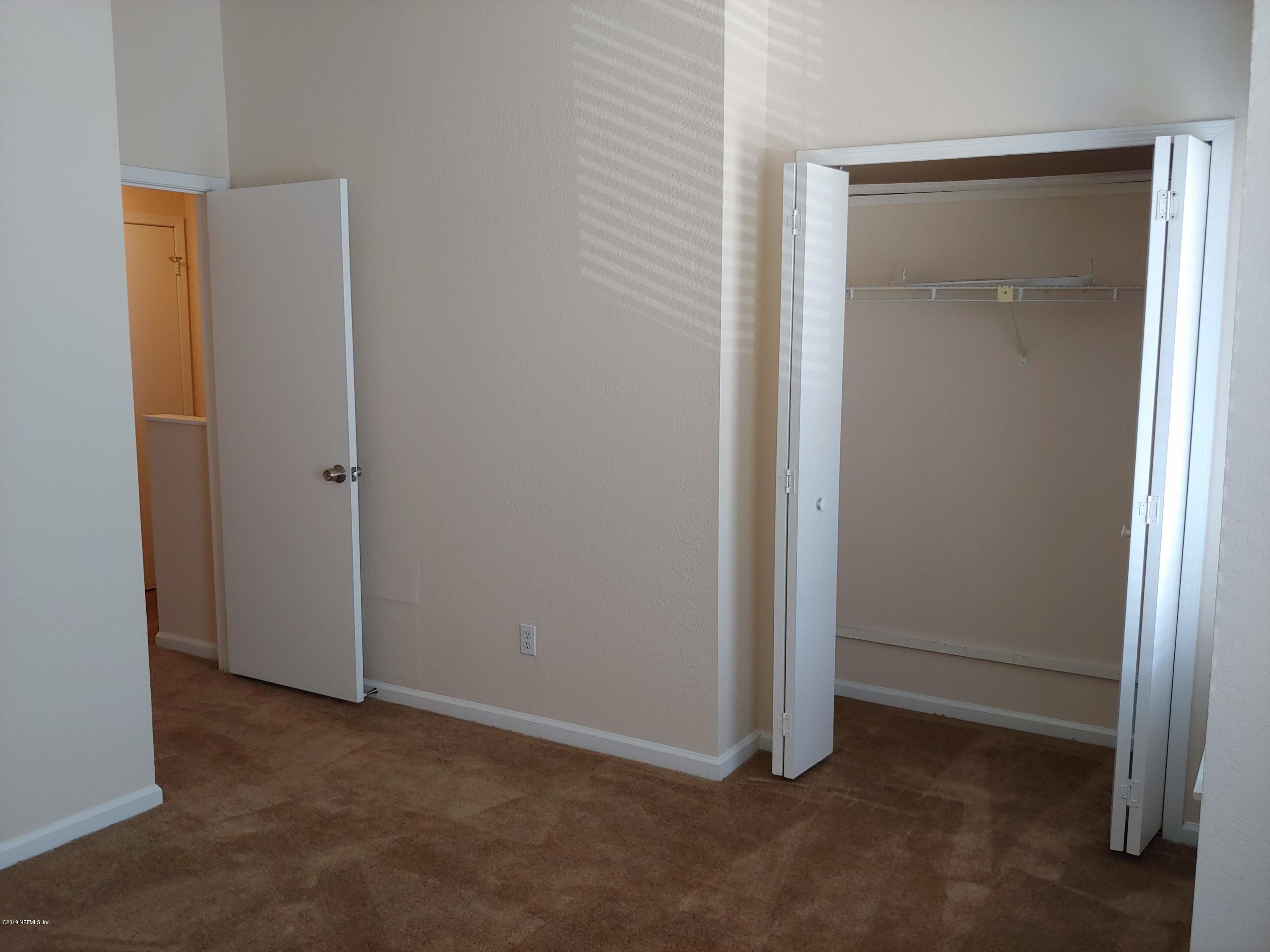 791 Assisi Lane, Unit 303 Jacksonville, FL 32233 - Photo 26 of 35 an empty room with closet