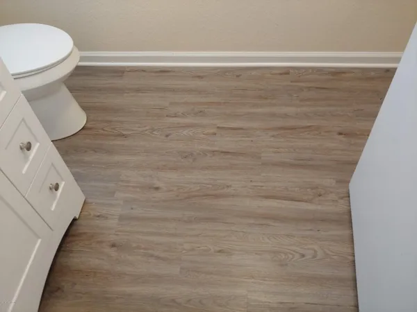 a bathroom with a toilet and a sink