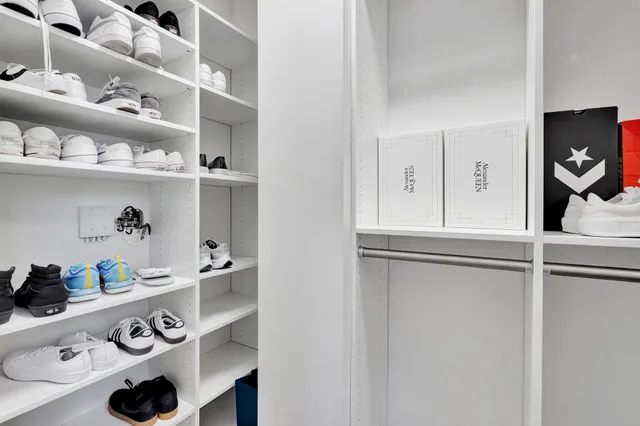 a kitchen with a cabinets and a stove with a wooden floor