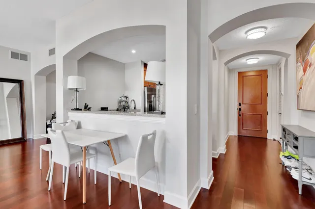 a view of a dining room with furniture and wooden floor