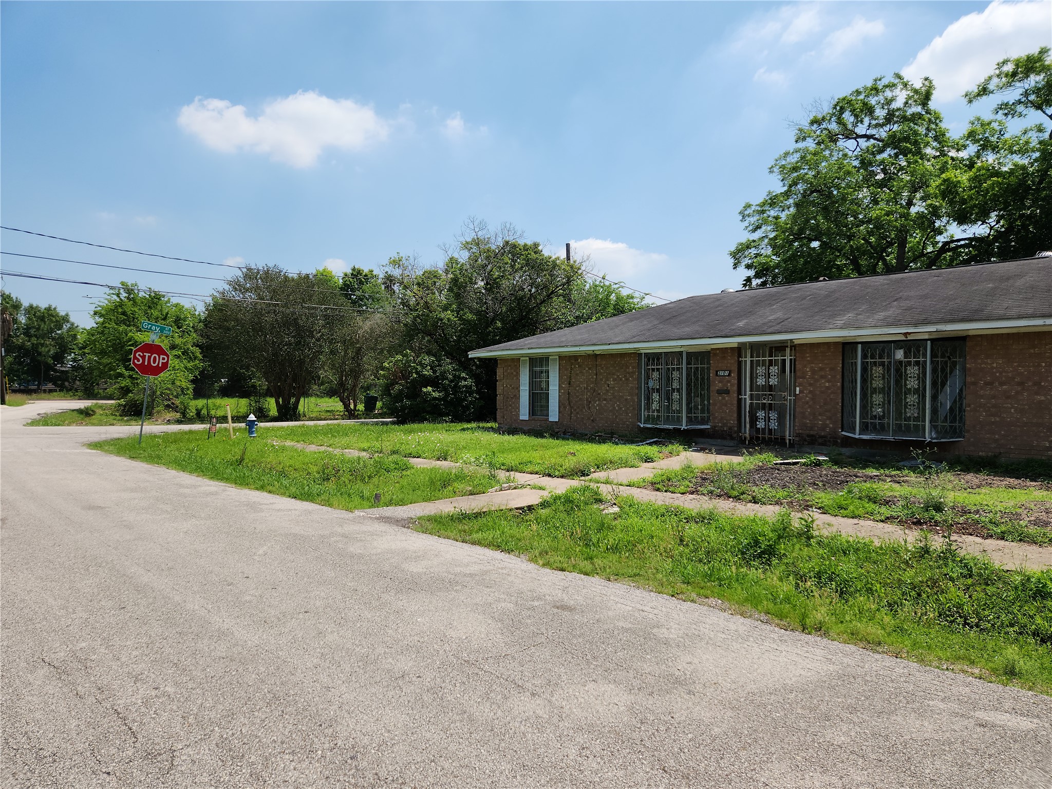 2101 Briley Street Houston, TX 77004 - Photo 6 of 7 a view of house with a big yard and potted plants