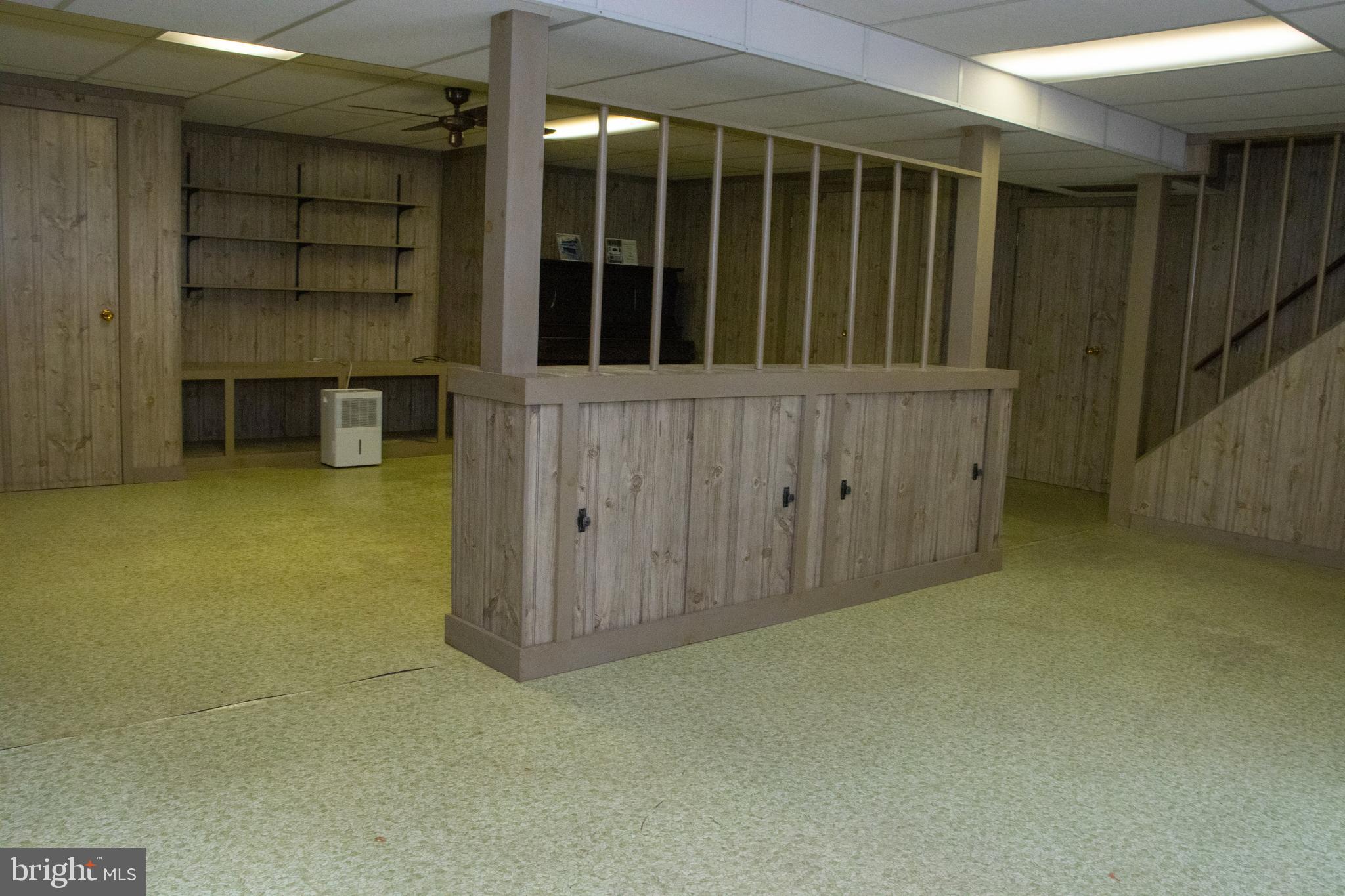 12212 Orange Plank Road Locust Grove, VA 22508 - Photo 50 of 76 Back wall has shelving or ready for big screen tv
