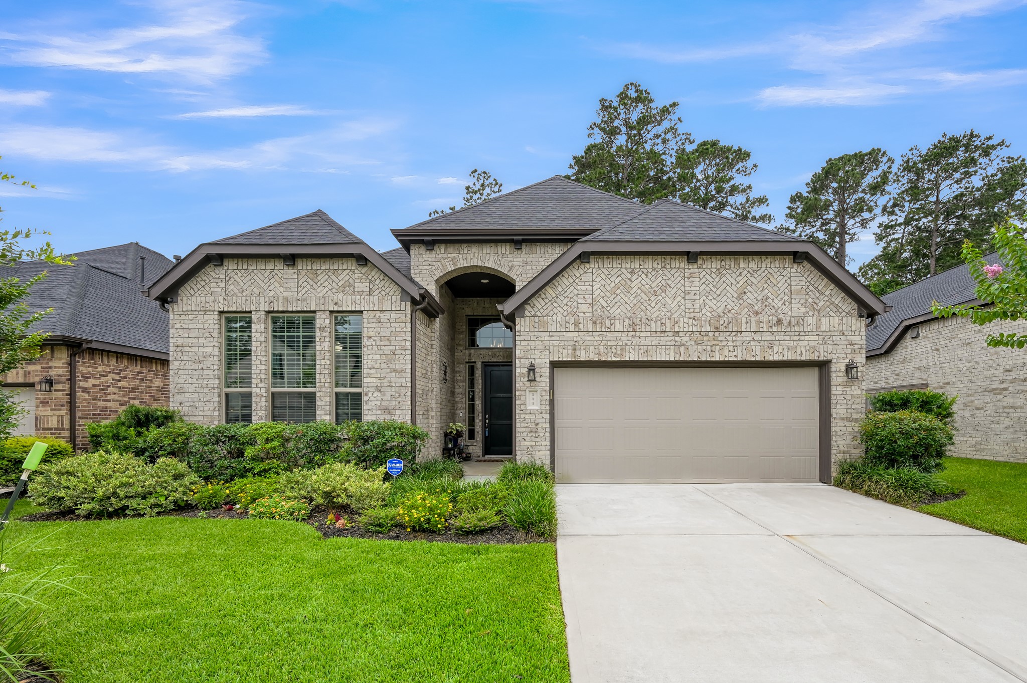111 Yellow Perch Way Conroe, TX 77318 - Photo 1 of 35 Beautiful brick and stone exterior with exceptional curb appeal.