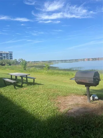 a view of a lake with a big yard