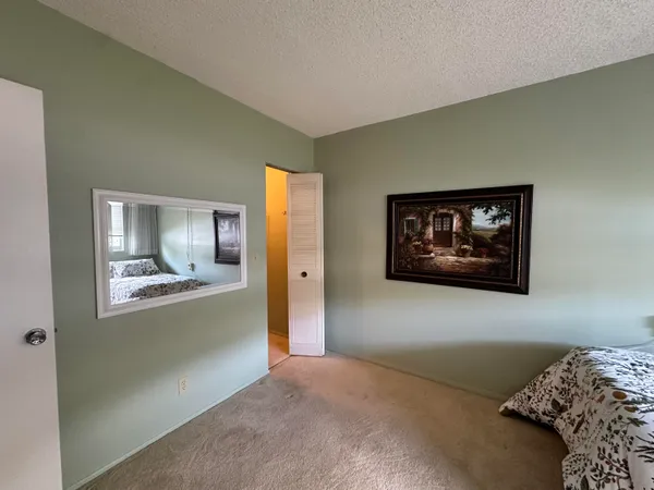a kitchen with a refrigerator sink and cabinets