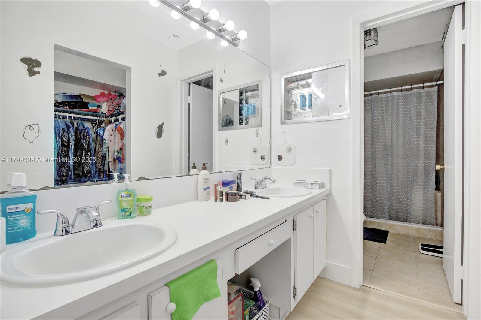1945 West 72nd Street Hialeah, FL 33014 - Photo 11 of 24 a bathroom with a double vanity sink mirror and double