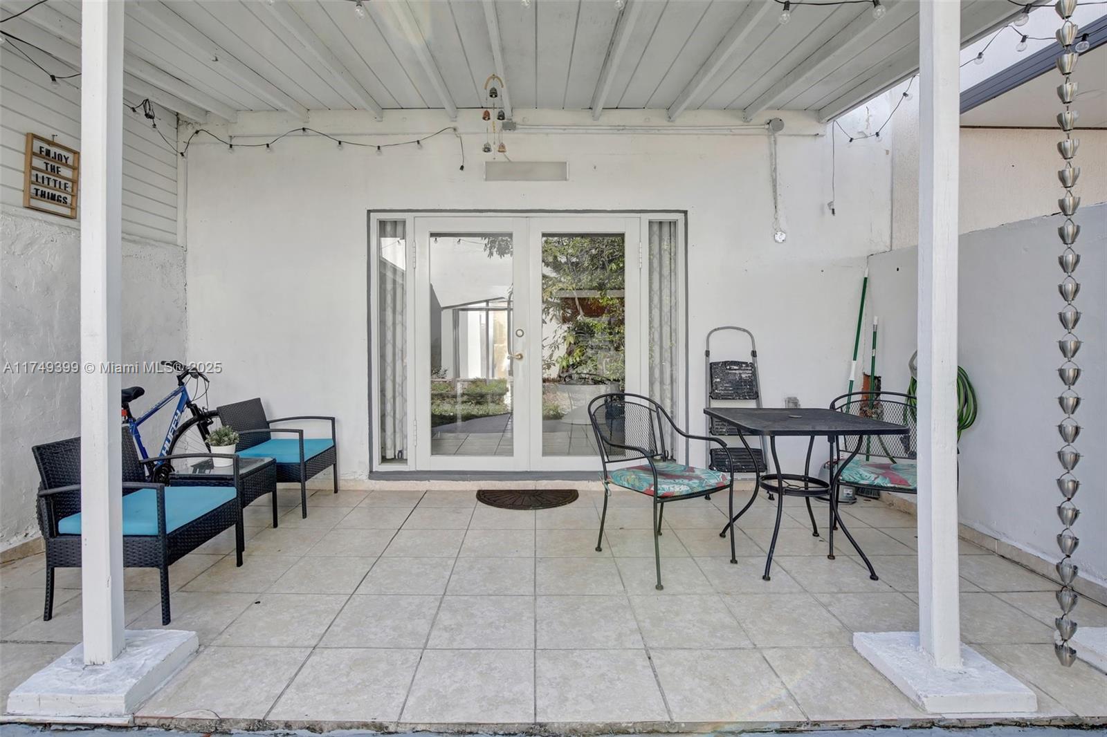 1945 West 72nd Street Hialeah, FL 33014 - Photo 19 of 24 a dining room with furniture and a chandelier