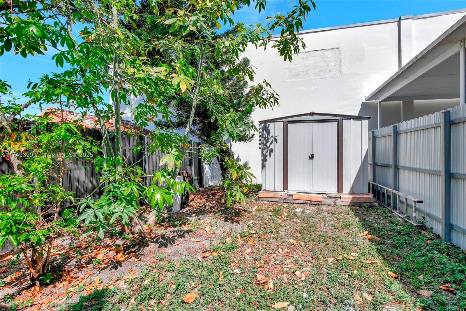 1945 West 72nd Street Hialeah, FL 33014 - Photo 22 of 24 a view of a house with a yard