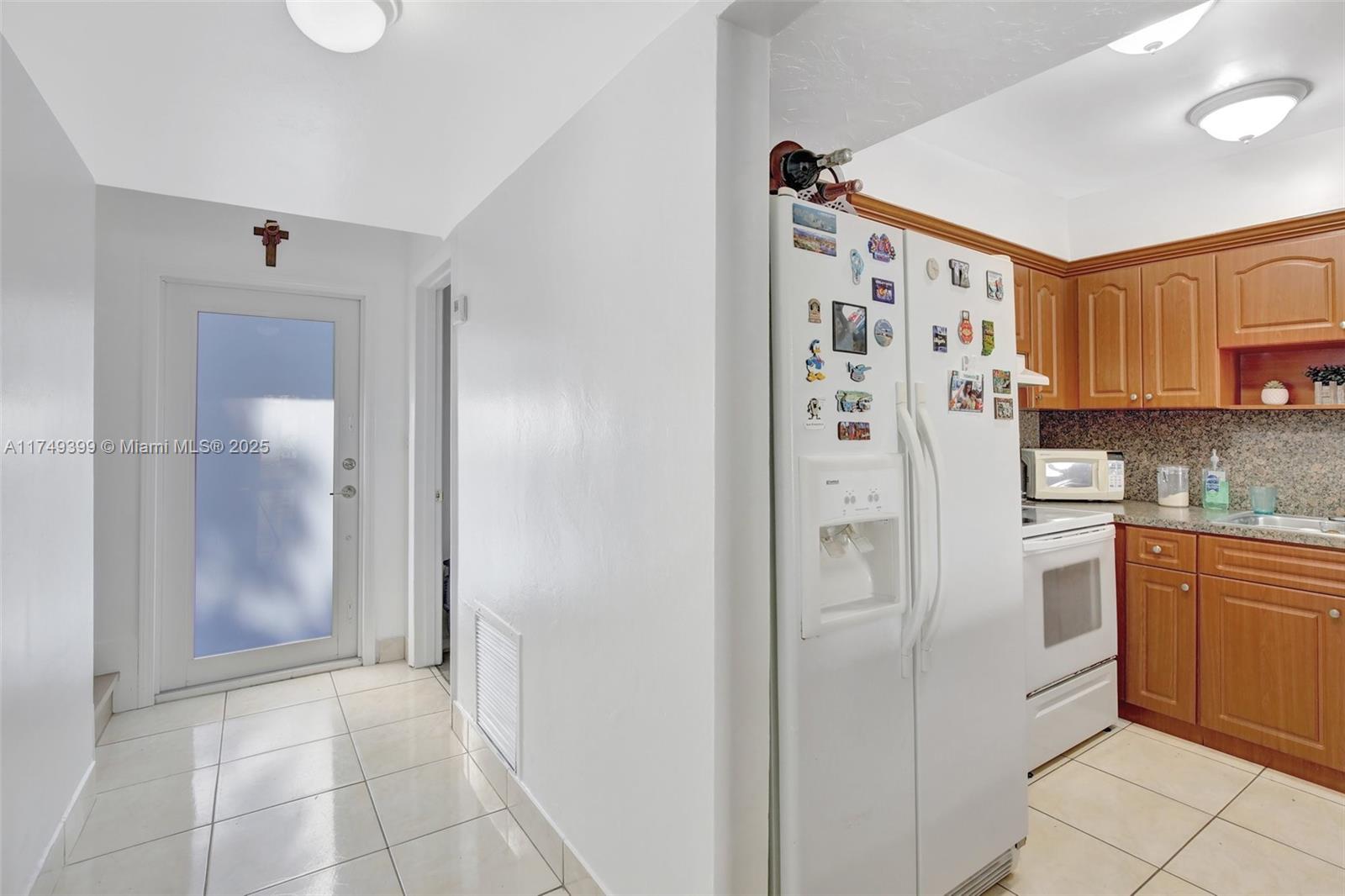 1945 West 72nd Street Hialeah, FL 33014 - Photo 5 of 24 a kitchen with stainless steel appliances a refrigerator and a sink