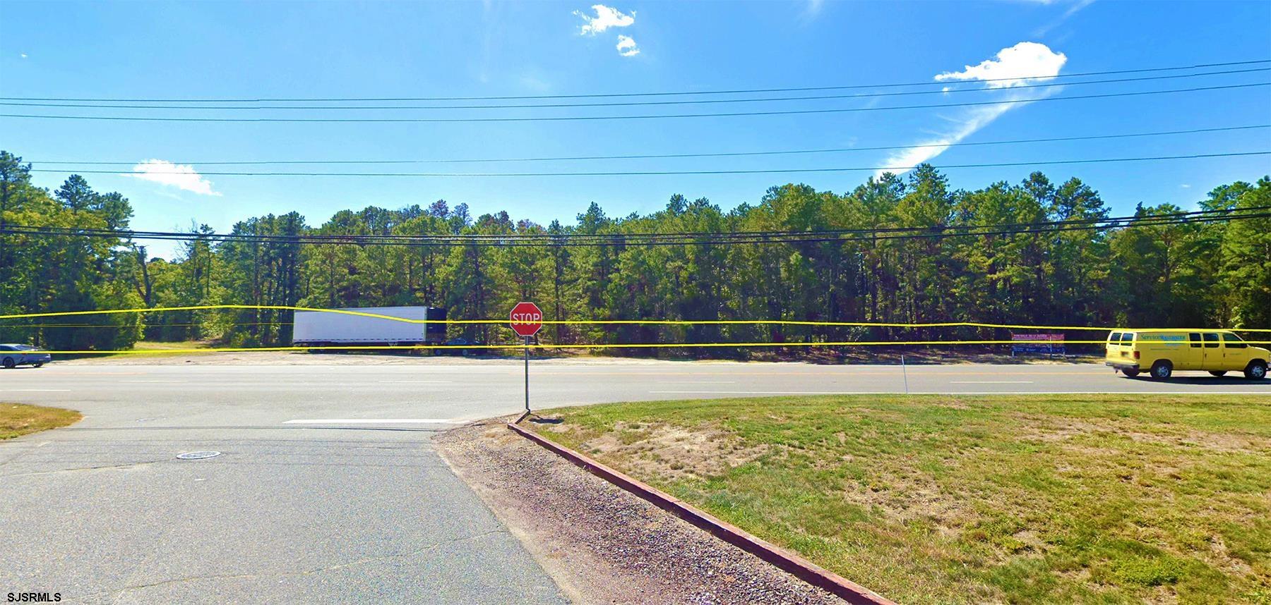 104-108 West White Horse Pike Absecon, NJ 08201 - Photo 11 of 11 a view of a swimming pool with a yard