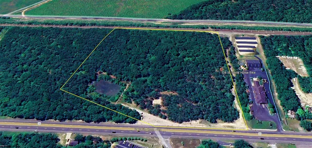 a view of a swimming pool with a yard