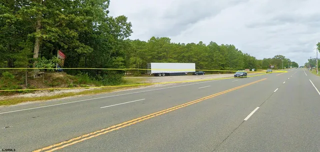 a view of a swimming pool with a yard