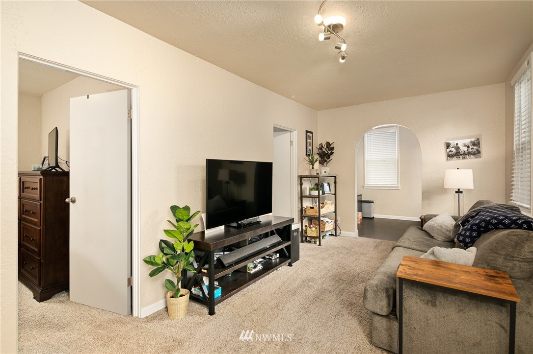 222 South 15th Street Renton, WA 98055 - Photo 17 of 34 a living room with furniture and a flat screen tv