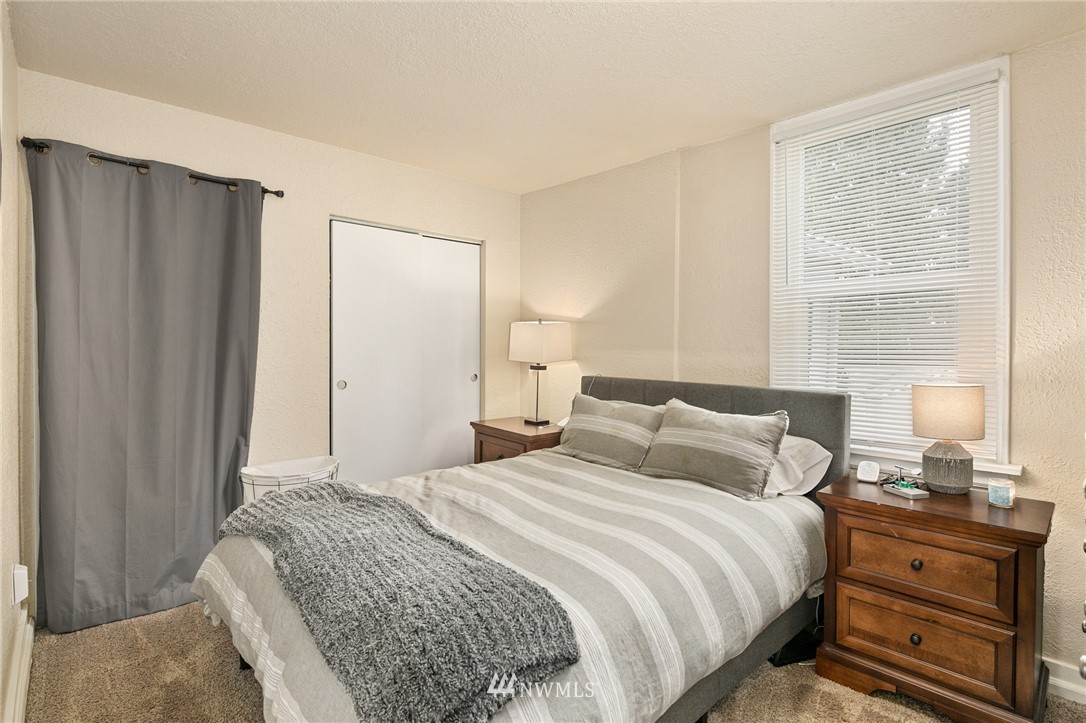 222 South 15th Street Renton, WA 98055 - Photo 22 of 34 a bedroom with a bed and wooden floor