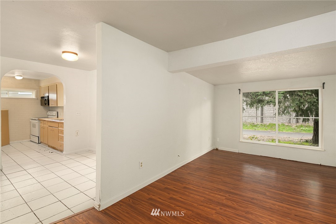 222 South 15th Street Renton, WA 98055 - Photo 32 of 34 a view of an empty room with wooden floor and a window