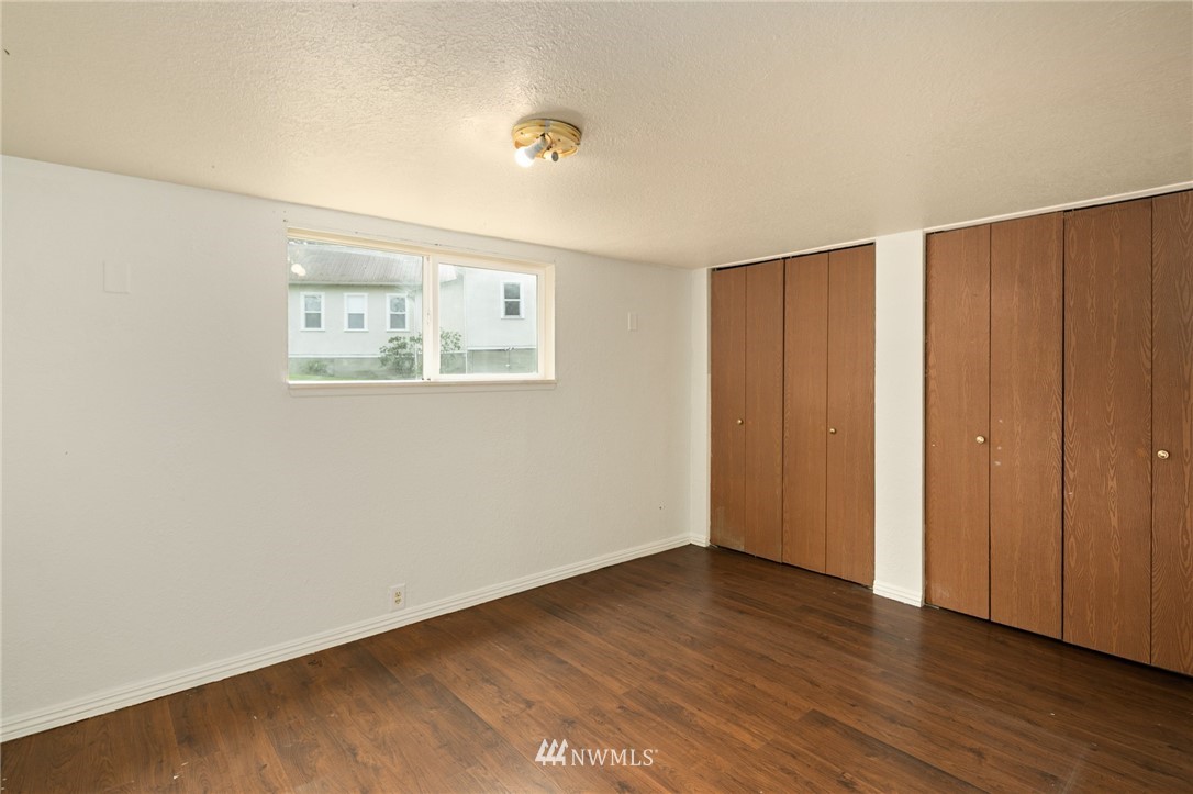 222 South 15th Street Renton, WA 98055 - Photo 33 of 34 a view of an empty room with wooden floor
