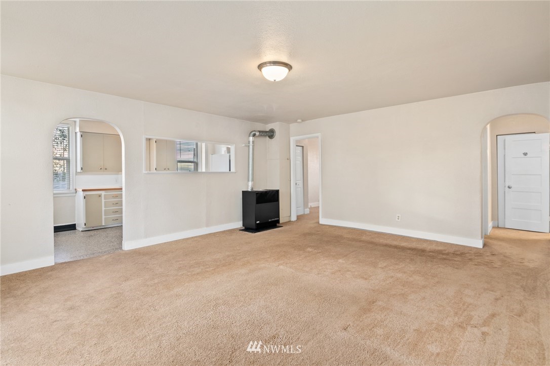 222 South 15th Street Renton, WA 98055 - Photo 4 of 34 an empty room with windows and fireplace