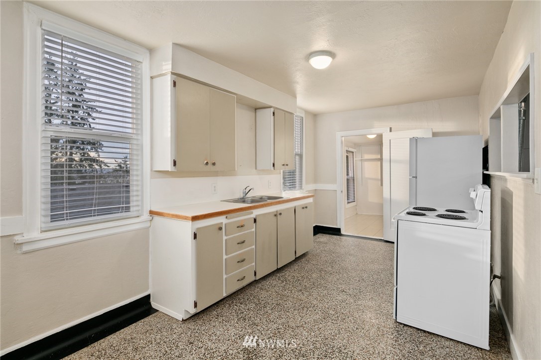 222 South 15th Street Renton, WA 98055 - Photo 5 of 34 a kitchen with white cabinets and white appliances