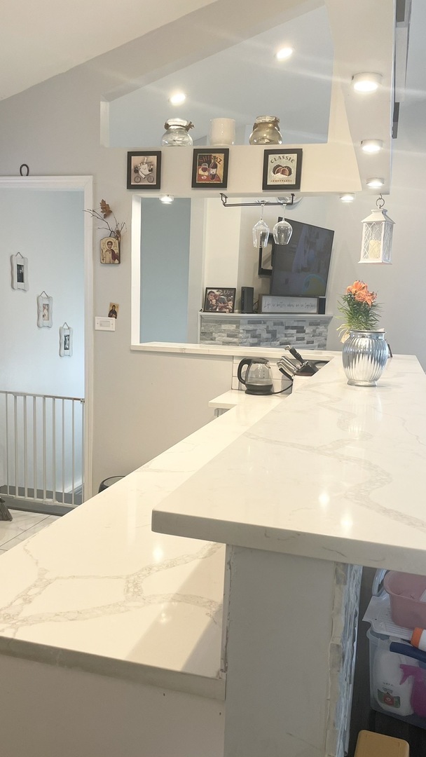 2749 Virginia Lane Glenview, IL 60025 - Photo 14 of 39 a kitchen with stainless steel appliances kitchen island sink refrigerator and stove
