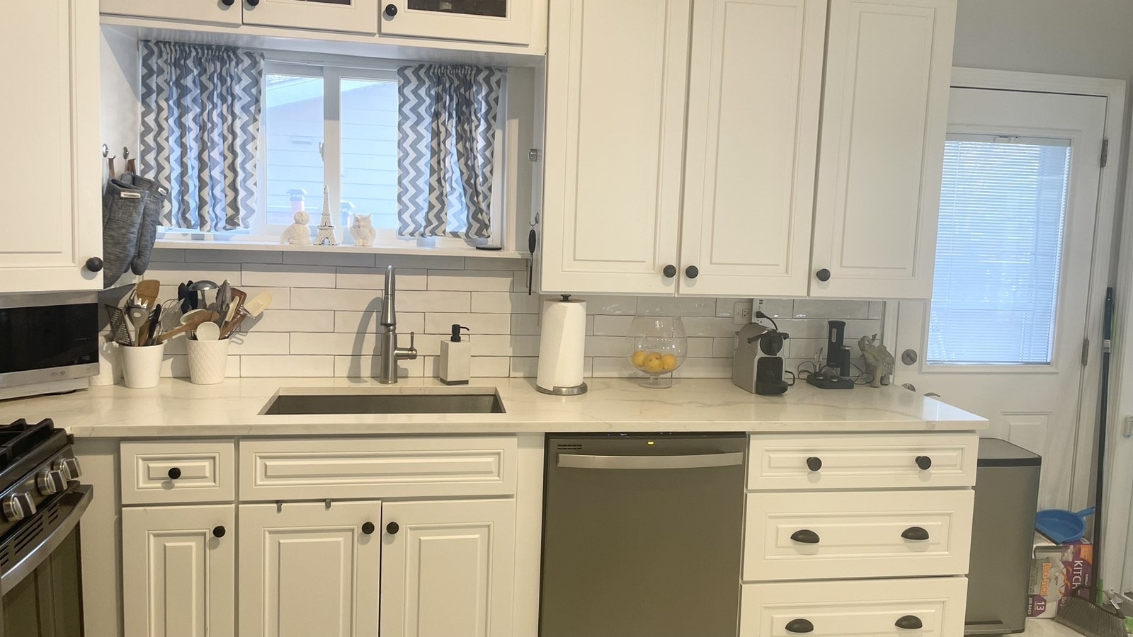 2749 Virginia Lane Glenview, IL 60025 - Photo 16 of 39 a kitchen with granite countertop a sink a stove and cabinets