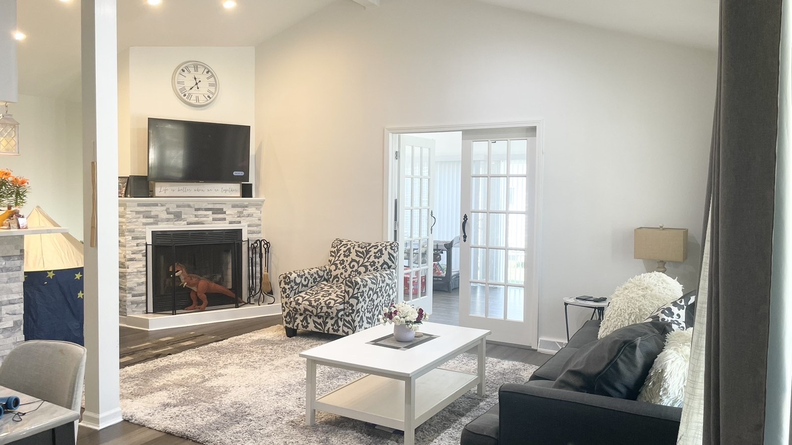 2749 Virginia Lane Glenview, IL 60025 - Photo 3 of 39 a living room with furniture a flat screen tv and a fireplace