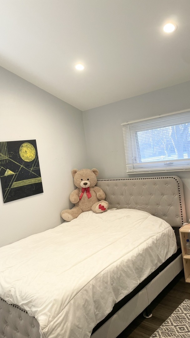 2749 Virginia Lane Glenview, IL 60025 - Photo 35 of 39 a bedroom with a bed and a lamp on dresser